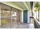 View from covered balcony with sliding glass doors and a black metal railing at 4403 S Semoran Blvd # 3, Orlando, FL 32822