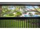 View of the community pool area from the balcony with black metal railings at 4403 S Semoran Blvd # 3, Orlando, FL 32822