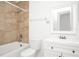 Bright bathroom featuring a white vanity, toilet, and a shower with beige tiling at 4403 S Semoran Blvd # 3, Orlando, FL 32822