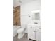 Well-lit bathroom features tiled shower, toilet, and vanity with storage at 4403 S Semoran Blvd # 3, Orlando, FL 32822