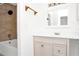 Bathroom featuring a tiled shower/tub, and a vanity with storage at 4403 S Semoran Blvd # 3, Orlando, FL 32822
