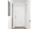 Bright entryway featuring tile floors, white walls, and a white front door at 4403 S Semoran Blvd # 3, Orlando, FL 32822