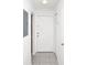 Bright entryway with tile floors, white walls, and a white front door at 4403 S Semoran Blvd # 3, Orlando, FL 32822