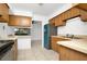 Kitchen view showing bar, tile floors, and modern stainless appliances at 4403 S Semoran Blvd # 3, Orlando, FL 32822