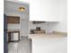 Kitchen view showing stainless dishwasher and tile floors at 4403 S Semoran Blvd # 3, Orlando, FL 32822