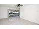 Bright living room with tile floors, ceiling fan, and sliding glass doors to the outside at 4403 S Semoran Blvd # 3, Orlando, FL 32822