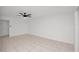 Living room featuring tile floors, ceiling fan, and white walls at 4403 S Semoran Blvd # 3, Orlando, FL 32822