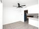 Bright living room featuring tile floors and views of the kitchen with stainless appliances at 4403 S Semoran Blvd # 3, Orlando, FL 32822