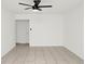 Bright living room featuring tile floors and a modern ceiling fan with lighting at 4403 S Semoran Blvd # 3, Orlando, FL 32822