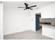 Bright living room featuring tile floors and views of the kitchen with stainless appliances at 4403 S Semoran Blvd # 3, Orlando, FL 32822