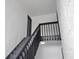 View of the stairway with dark wood handrail leading to the condo entrance at 4403 S Semoran Blvd # 3, Orlando, FL 32822