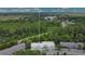 Birds eye view of townhomes surrounded by lush greenery and a scenic lake in the distance at 4443 Brook Hollow Cir # 19A, Winter Springs, FL 32708