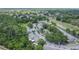 Elevated aerial view showcases a community surrounded by mature trees, highlighting convenient parking and green spaces at 4443 Brook Hollow Cir # 19A, Winter Springs, FL 32708