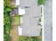 Aerial shot showing townhouse rooftops, complemented by green lawns, mature trees, and a shared outdoor deck area at 4443 Brook Hollow Cir # 19A, Winter Springs, FL 32708