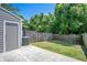 A view of the house's back yard and fence on a sunny day at 4443 Brook Hollow Cir # 19A, Winter Springs, FL 32708