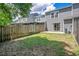 A view of the townhouse backyard featuring a well-maintained fence and lawn, promoting outdoor enjoyment and privacy at 4443 Brook Hollow Cir # 19A, Winter Springs, FL 32708