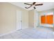 Spacious bedroom with ceiling fan, tile flooring and neutral color palette at 4443 Brook Hollow Cir # 19A, Winter Springs, FL 32708