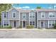 Inviting townhouse community with neutral exteriors and well-kept landscaping; ample parking for residents and guests at 4443 Brook Hollow Cir # 19A, Winter Springs, FL 32708