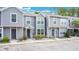 Inviting two-story townhome showcases a manicured lawn, with a convenient parking area at 4443 Brook Hollow Cir # 19A, Winter Springs, FL 32708