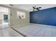 Open-concept living room featuring stylish accents, tile flooring, and a seamless connection to the kitchen at 4443 Brook Hollow Cir # 19A, Winter Springs, FL 32708