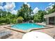 Community pool featuring brick pavers, multiple chairs and tables for relaxing in the sun at 4443 Brook Hollow Cir # 19A, Winter Springs, FL 32708