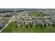 Aerial view of the neighborhood with single-Gathering homes, green spaces, and tree-lined streets at 565 Ogelthorpe Dr, Davenport, FL 33897