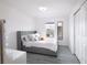 Bright bedroom with a soft bed, modern lighting, a window and a convenient closet at 565 Ogelthorpe Dr, Davenport, FL 33897