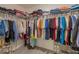Walk-in closet with ample hanging storage and shelving for organization at 565 Ogelthorpe Dr, Davenport, FL 33897