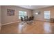 Dining room with a glass table, modern chairs, and tile flooring at 565 Ogelthorpe Dr, Davenport, FL 33897