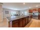 Spacious kitchen island with granite countertops and stainless steel appliances at 565 Ogelthorpe Dr, Davenport, FL 33897