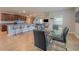 Open concept kitchen and dining area with a bar, dining table, and view of the living room at 565 Ogelthorpe Dr, Davenport, FL 33897