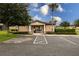 Community pool entrance with a gated entry, accessible parking, and well-maintained landscaping at 565 Ogelthorpe Dr, Davenport, FL 33897