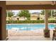 Inviting community pool view from a covered patio area at 565 Ogelthorpe Dr, Davenport, FL 33897