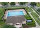 Overhead view of community pool surrounded by lush landscaping at 565 Ogelthorpe Dr, Davenport, FL 33897