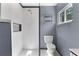 Stylish bathroom featuring a glass-enclosed shower with white tile, contrasting with the sleek, modern fixtures at 600 Sheridan Blvd, Orlando, FL 32804
