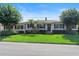 Charming single-story home with a manicured lawn, mature trees, and blooming hydrangeas, creating beautiful curb appeal at 600 Sheridan Blvd, Orlando, FL 32804