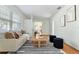 Comfortable living room featuring hardwood floors, neutral decor, modern furnishings, and an open layout with plenty of natural light at 600 Sheridan Blvd, Orlando, FL 32804
