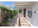 Charming patio with brick flooring, wooden fence, and a pergola for shade in this backyard space at 600 Sheridan Blvd, Orlando, FL 32804