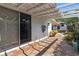 Charming brick-paved patio with a covered pergola, offering a serene outdoor living space with direct access to the home at 600 Sheridan Blvd, Orlando, FL 32804