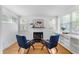 Bright sitting room featuring hardwood floors, fireplace, modern decor, and an inviting open layout with ample natural light at 600 Sheridan Blvd, Orlando, FL 32804