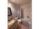 Cozy bathroom featuring a tiled tub/shower combo, granite vanity, and modern fixtures at 6013 Scotchwood Gln # 20, Orlando, FL 32822