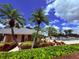 Community pool and clubhouse with well-maintained landscaping and ample seating at 6013 Scotchwood Gln # 20, Orlando, FL 32822