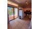 Eat-in kitchen with stainless steel appliances and a sliding glass door leading to patio at 6013 Scotchwood Gln # 20, Orlando, FL 32822