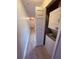 Hallway with stackable washer and dryer, offering convenient laundry solutions at 6013 Scotchwood Gln # 20, Orlando, FL 32822