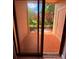 View of the patio featuring tiled flooring and sliding glass doors opening to the outside greenery at 6013 Scotchwood Gln # 20, Orlando, FL 32822