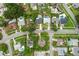 An aerial view shows homes in a residential neighborhood with mature trees and community layout at 607 Green Briar Blvd, Altamonte Springs, FL 32714