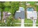 High-angle view of the home showcasing its roof, yard, and proximity to neighboring properties and pools at 607 Green Briar Blvd, Altamonte Springs, FL 32714
