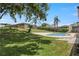 Landscaped backyard with a large in-ground swimming pool and palm trees at 607 Green Briar Blvd, Altamonte Springs, FL 32714