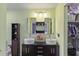 Bright bathroom with double sinks, storage and closet access at 607 Green Briar Blvd, Altamonte Springs, FL 32714