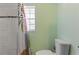 The bathroom features tiled walls and a decorative shower curtain at 607 Green Briar Blvd, Altamonte Springs, FL 32714